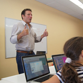 Ignite Creative Learning classroom photograph 8 of 8 showing students and an instructor working at computers.
